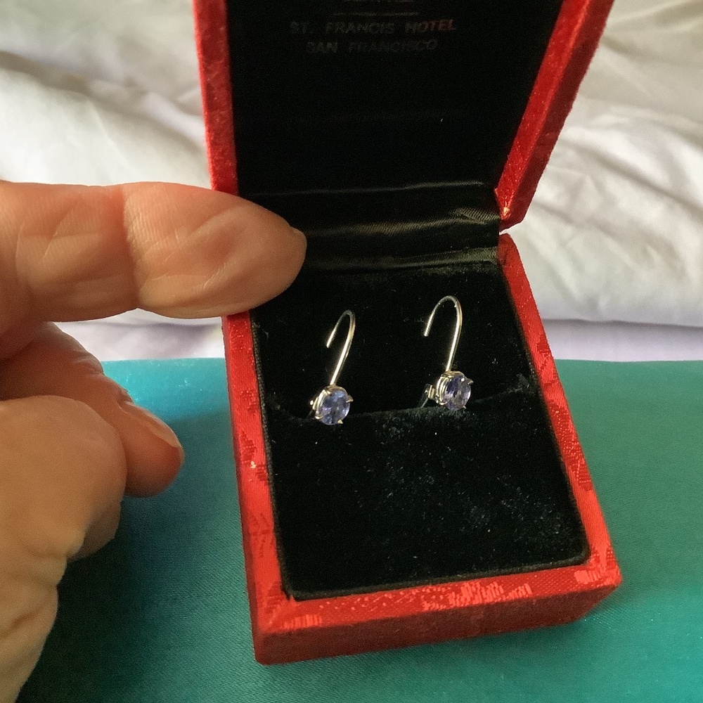 14kt white gold  and tanzanite earrings .see attached appraisal with details.